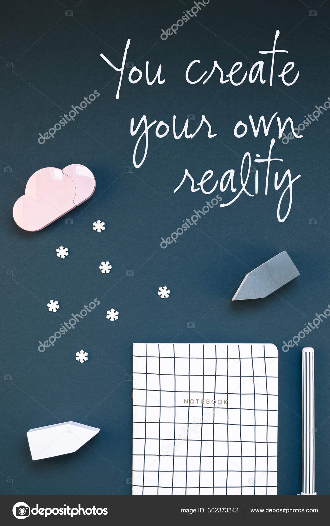 Top view flat lay feminine desk workspace with office supplies and inspirational text You create your own reality black background. Creative template for blog social media. Winter concept composition